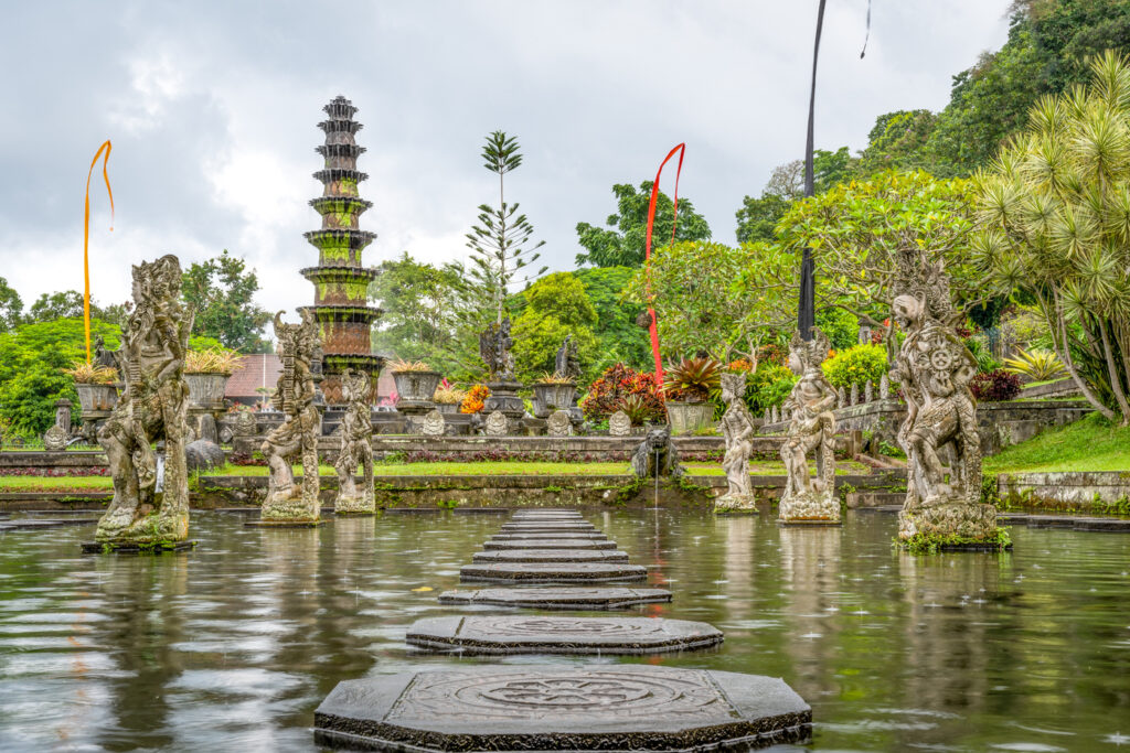 Gorgeous shot of Tirta Gangga in Indonesia, showing a beautiful lake, surreal garden and statues